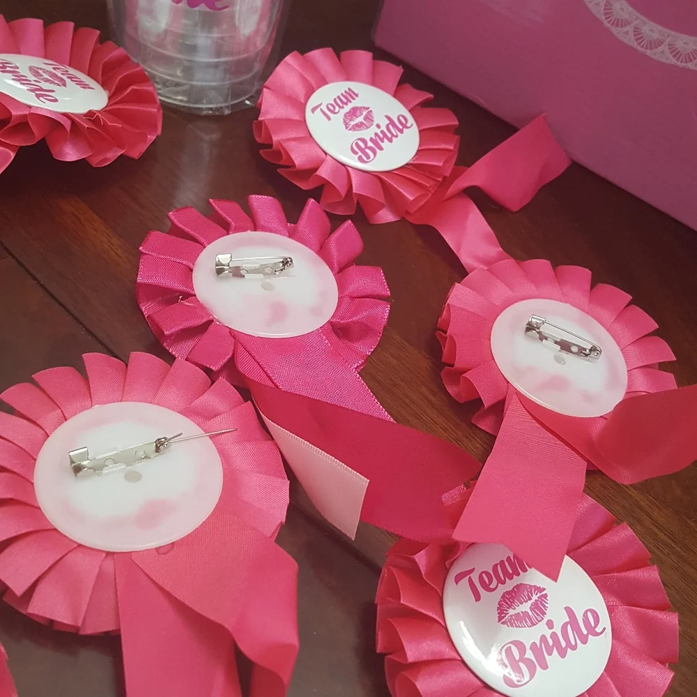 Team bride. Cups and lapel pins.